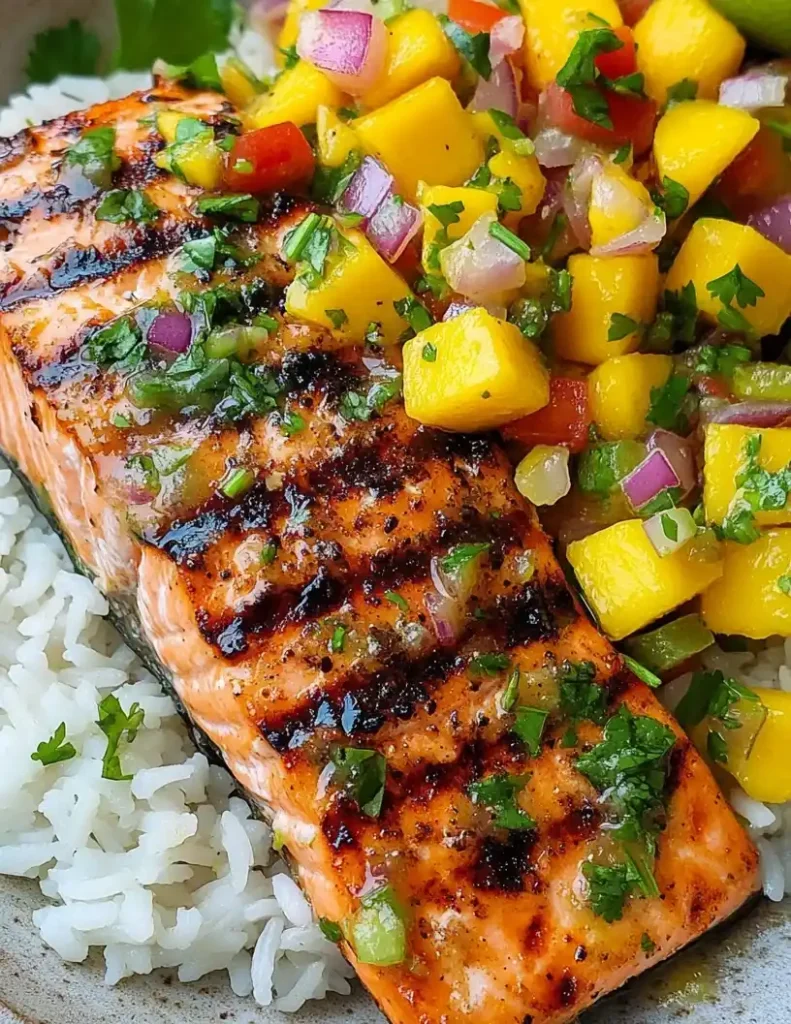 Grilled salmon with mango salsa close up